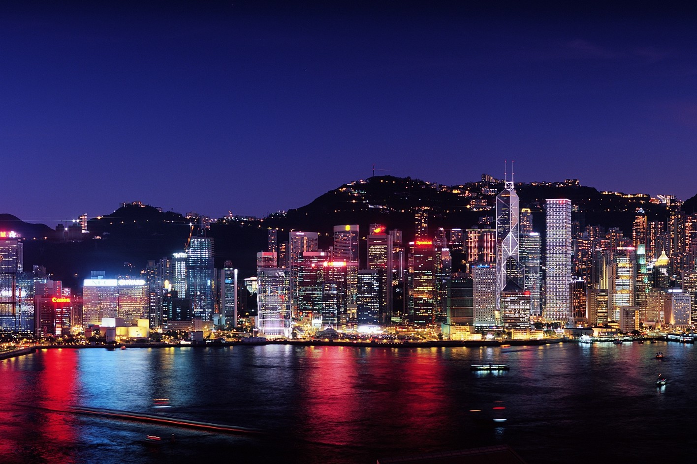 Photo of the Hong Kong cityscape at night from the view of the ocean