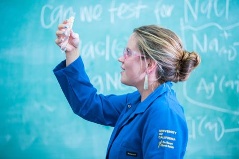 Student holding test tube